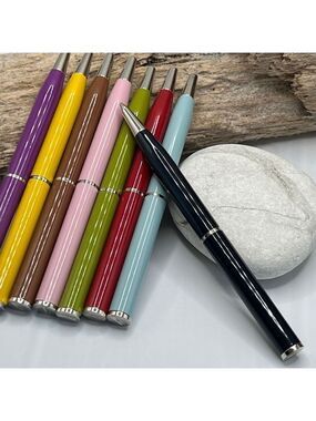 Brown Coach Wallet Blue Ink Pen